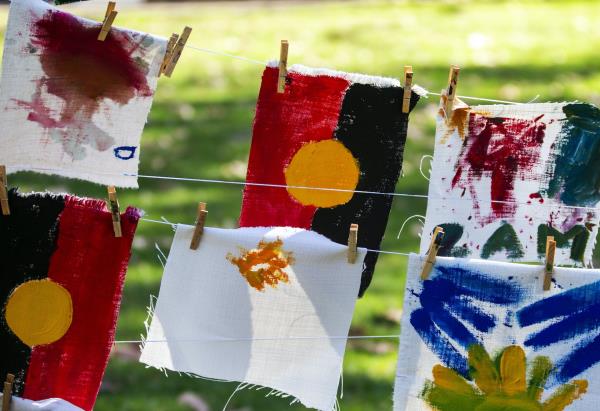 Hand painted Aboriginal flags hung on a line