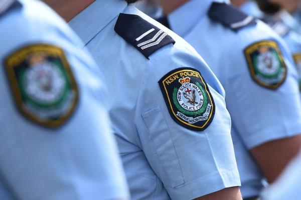 Close up of NSW Police badge on shoulder of police officers