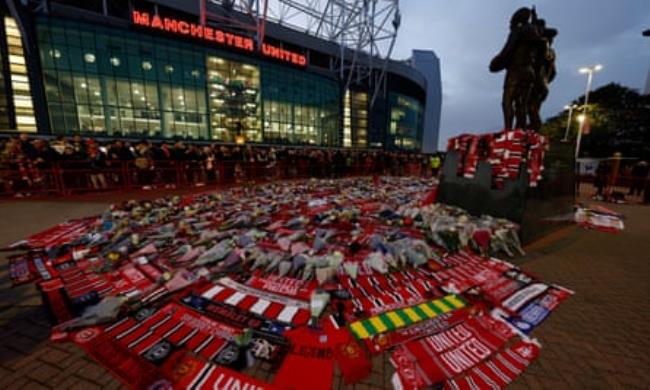 Scarves and flowers laid outside Old Trafford in memory of Sir Bobby Charlton