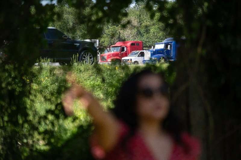 Erandi Trevino stands outside her home, located next to a parking lot wher<em></em>e trucks park and idle in Houston, Texas on June 27, 2